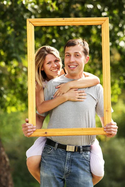 Couple in love in a frame on the nature — Stock Photo, Image
