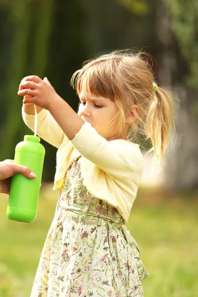 Little girl with soap bubbles — Stock Photo, Image