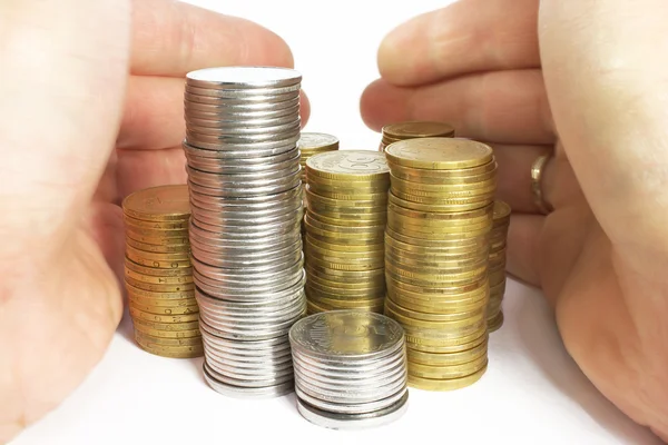 Hands and stacks of coins isolated — Stock Photo, Image