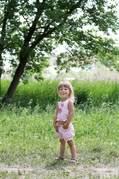 Beautiful little girl on nature — Stock Photo, Image