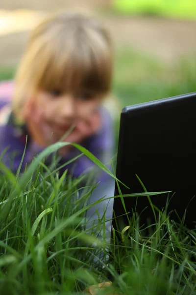 Little girl with a laptop, Royalty Free Stock Photos