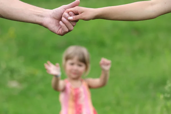 Two arms of lovers and young daughter — Stock Photo, Image