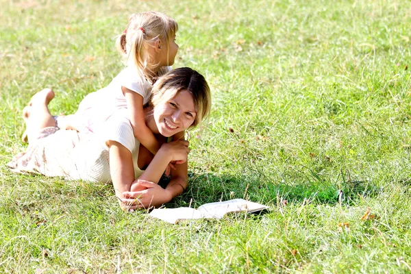 Mother with baby on grass — Stock Photo, Image