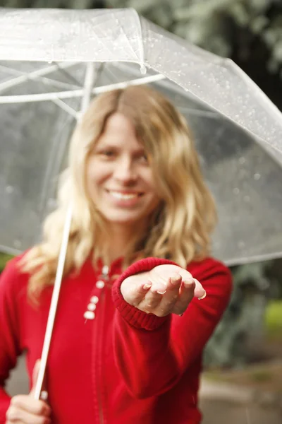 A woman with an umbrella in the rain — Stock Photo, Image