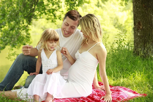 Young family on the nature — Stock Photo, Image