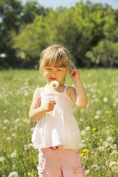 Little girl with dandelion — Stock Photo, Image