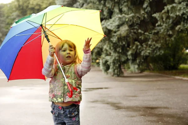 Beautiful little girl with an umbrella Stock Image