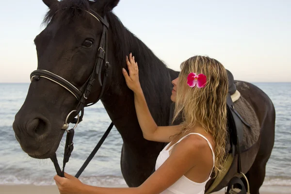 Girl with a horse by the sea — Stock Photo, Image