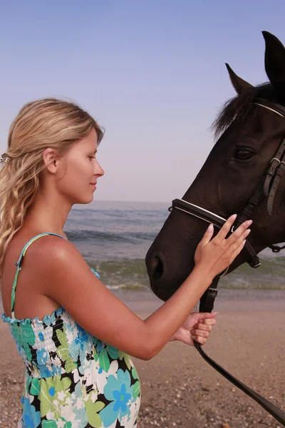 Girl with a horse by the sea — Stock Photo, Image