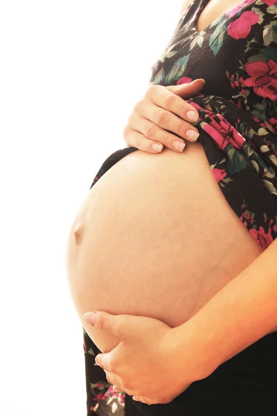 De zwangere vrouw op een witte achtergrond — Stockfoto