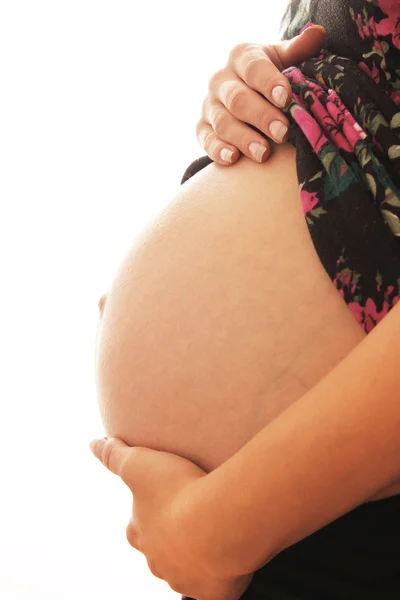 De zwangere vrouw op een witte achtergrond — Stockfoto