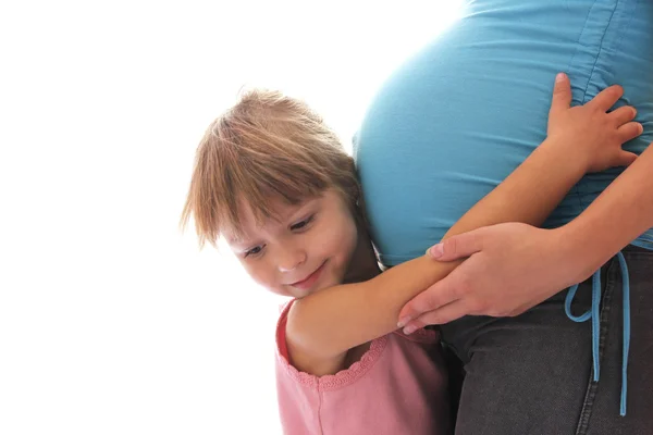 Una donna incinta con un bambino su uno sfondo bianco , — Foto Stock