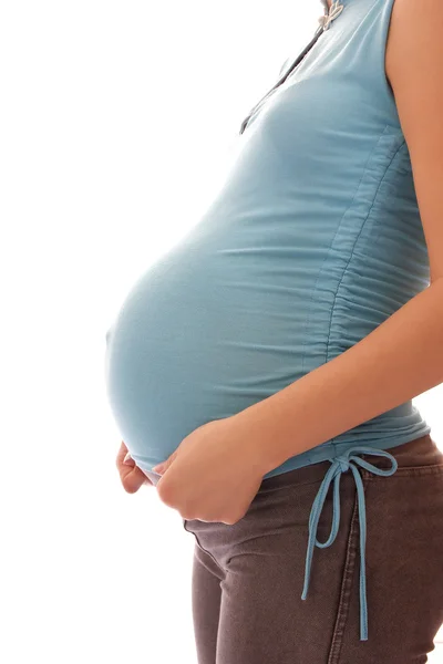 De zwangere vrouw op een witte achtergrond — Stockfoto