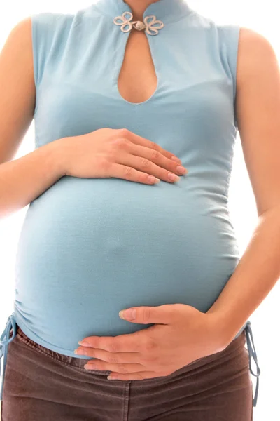 La femme enceinte sur fond blanc — Photo