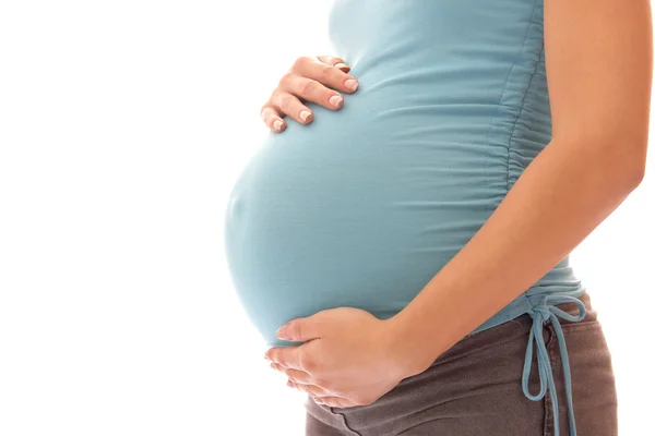 De zwangere vrouw op een witte achtergrond — Stockfoto