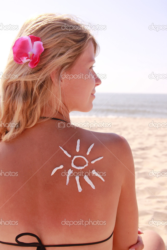 sun cream on the female back