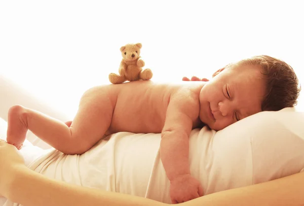 Newborn baby lying on his mom — Stock Photo, Image