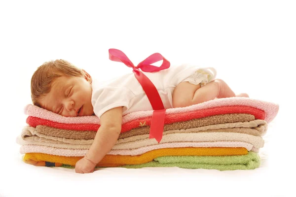 Newborn baby lying on towels — Stock Photo, Image