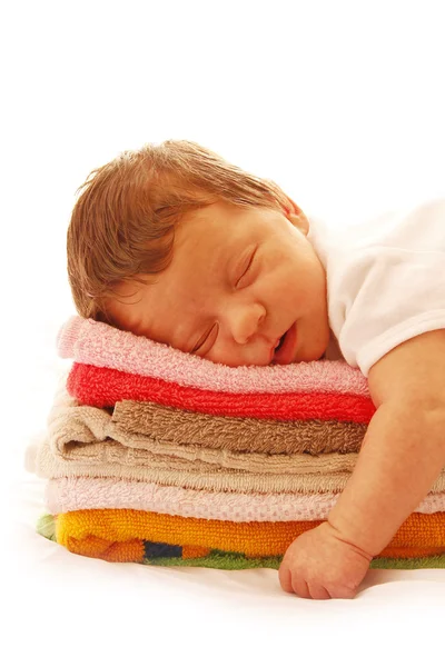 Newborn baby lying on towels — Stock Photo, Image