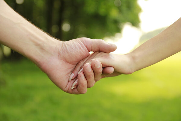 two hands in love couple on nature 