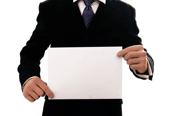 Homem segurando uma folha de papel branco — Fotografia de Stock