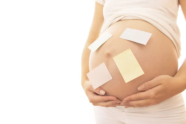 Pregnant woman with stickers Stock Image