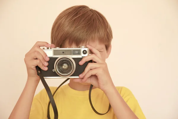 Child with old camera — Stock Photo, Image