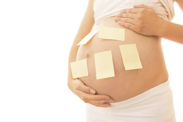 Pregnant woman with stickers Stock Photo