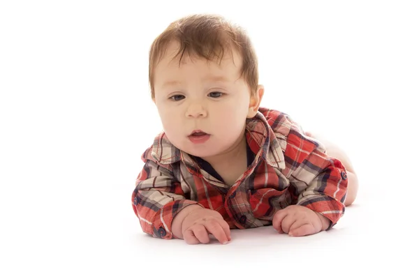 Bebê infantil em um fundo branco em uma camisa — Fotografia de Stock