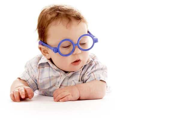 Infant baby on a white background in glasses — Stock Photo, Image