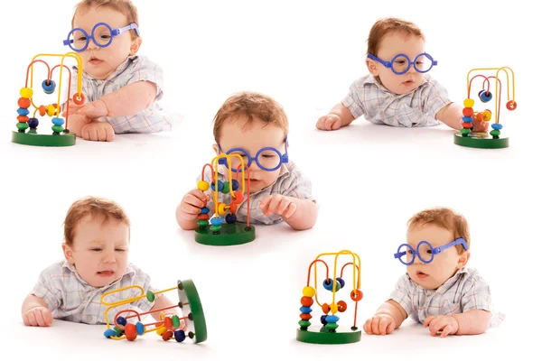 Coleção da criança em um fundo branco em copos com brinquedo — Fotografia de Stock