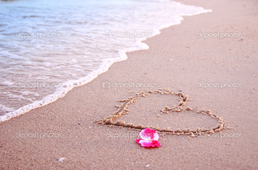 Heart in the sand on the seashore