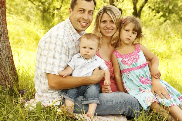 Young beautiful family outdoors — Stock Photo, Image