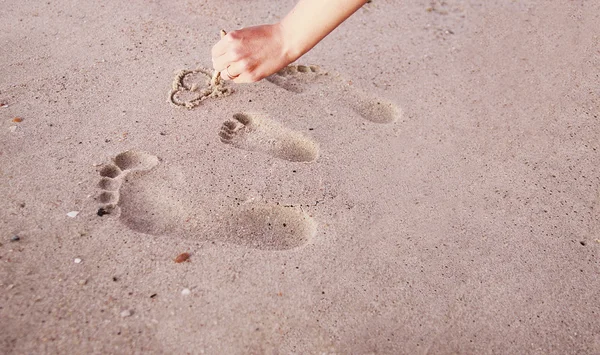 Family footprints in the sand — Stock Photo, Image