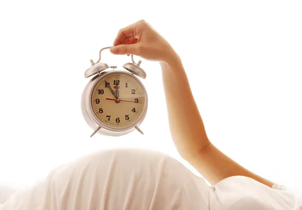 Pregnant woman with alarm clock — Stock Photo, Image