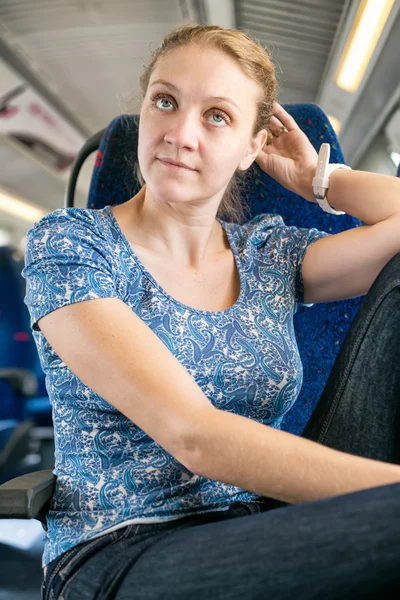 Woman corrected her hair in the train — Stock Photo, Image