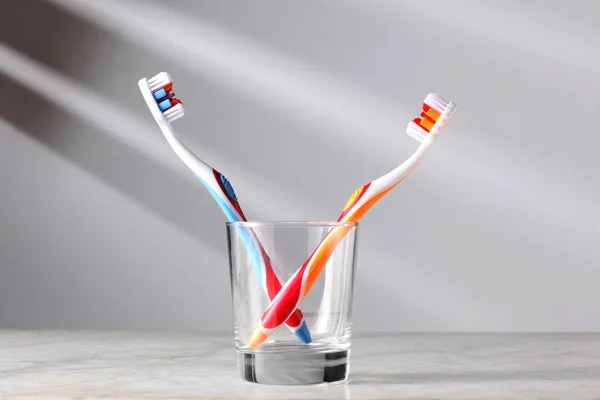 Two Toothbrushes Glass Copy Space Your Text — Stock Photo, Image