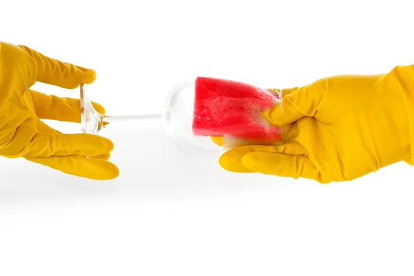 Hands in rubber gloves washing a glass — Stock Photo, Image