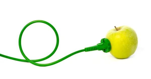 Green power cord plugged into apple outlet — Stock Photo, Image