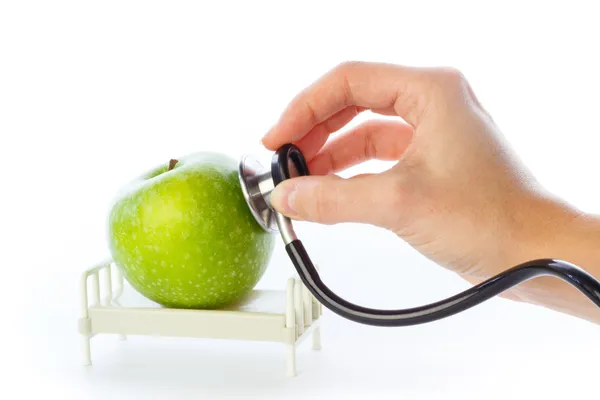 Apfel wird im Krankenhausbett versorgt — Stockfoto
