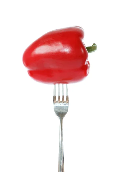 Hele rode paprika gevestigd op een vork — Stockfoto