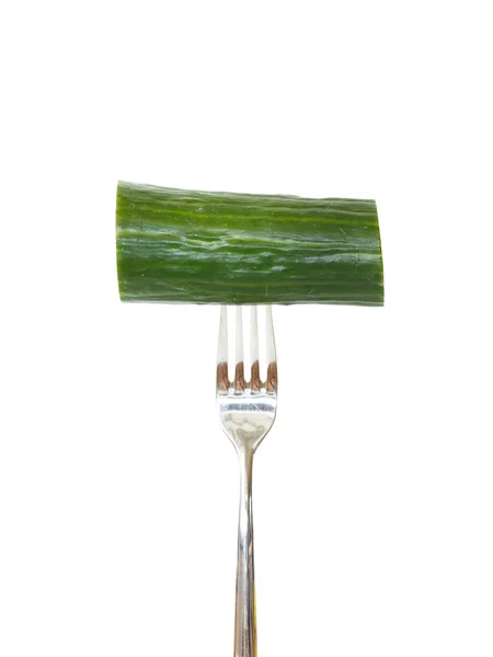 Large piece of cucumber pinned on a fork — Stock Photo, Image