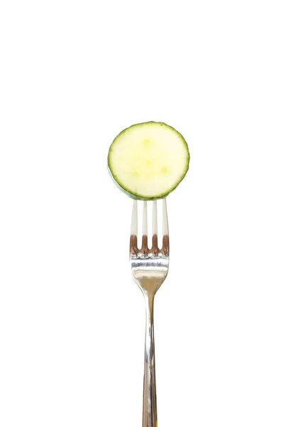 Slice of cucumber pinned on a fork — Stock Photo, Image