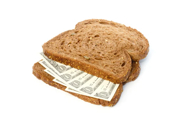 Iki dilim ekmek dolarlık banknotlar ile yayılan sandviç — Stok fotoğraf