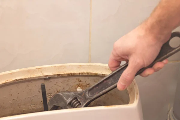 Man Performs Toilet Flush Tank — Stock Photo, Image