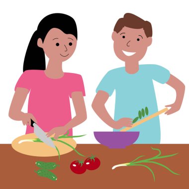 Genç bir adam ve kadın yemek pişiriyor..