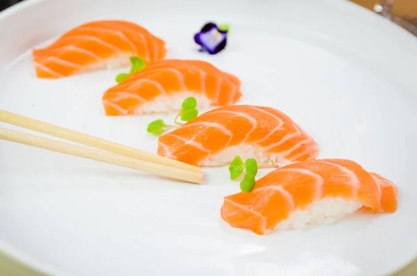Delicious Premium Salmon Nigiri Handmade White Plate Decorated Edible Flower — Stock Photo, Image