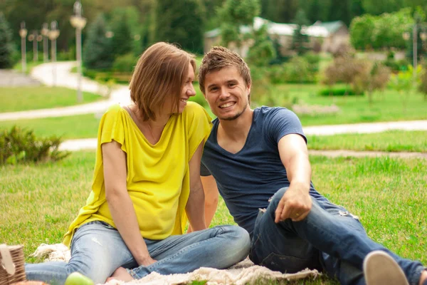 Young pretty pregnant woman with young man outdoor — Stock Photo, Image