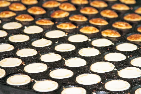 Freshly baked traditional Dutch mini pancakes called "poffertjes — Stock Photo, Image