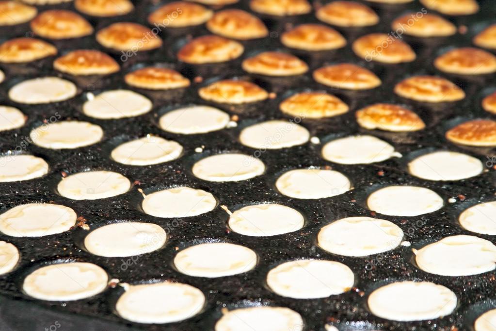 Freshly baked traditional Dutch mini pancakes called 